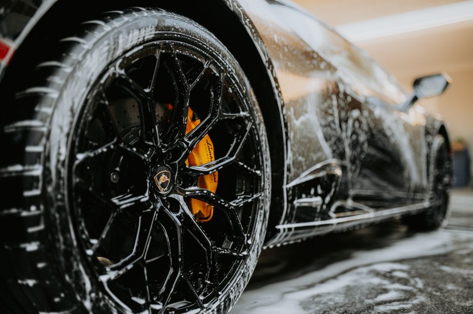Premium car wash foam applied to a luxury vehicle